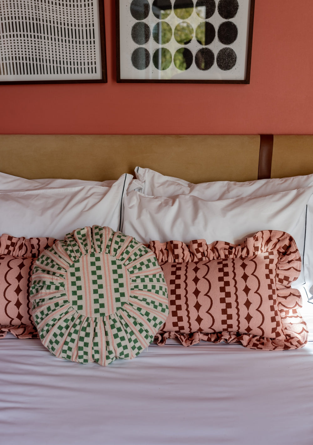 TBCo Cotton Cushion Cover in Pink Ruffle displayed on bed with decorative round cushion, showing ruffled texture against white bedding