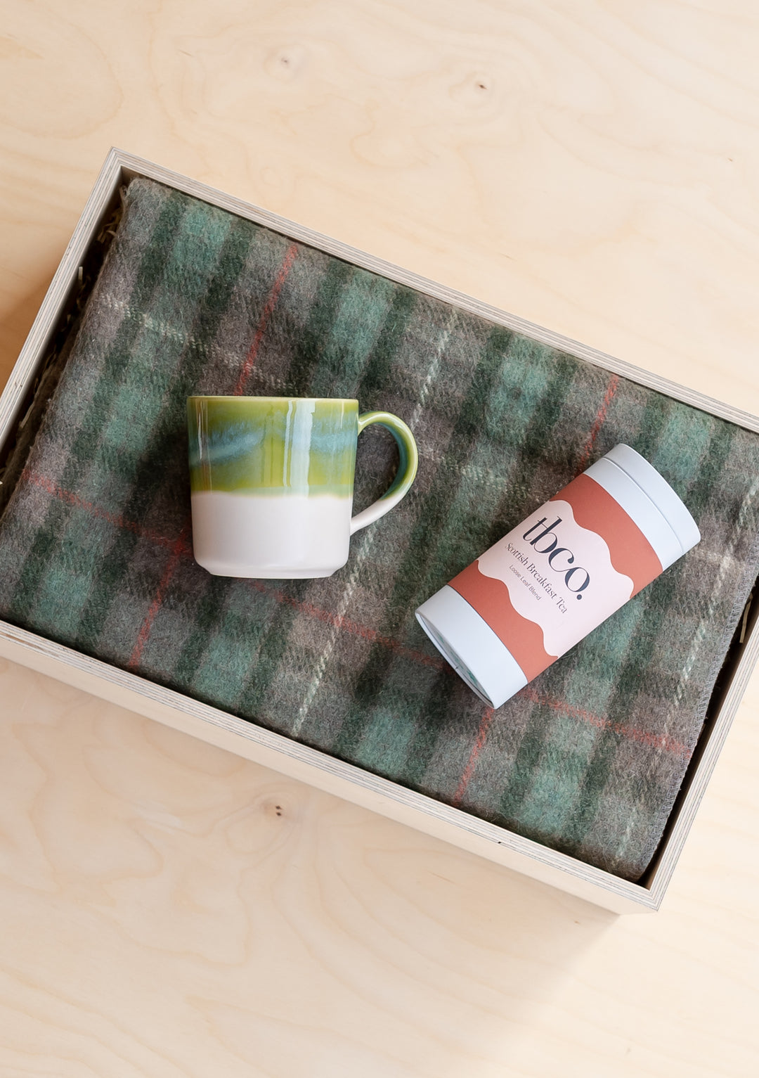 TBCo Ready-Made Share Warmth Gift Box featuring green tartan blanket, dip-glazed mug and Scottish breakfast tea in wooden box