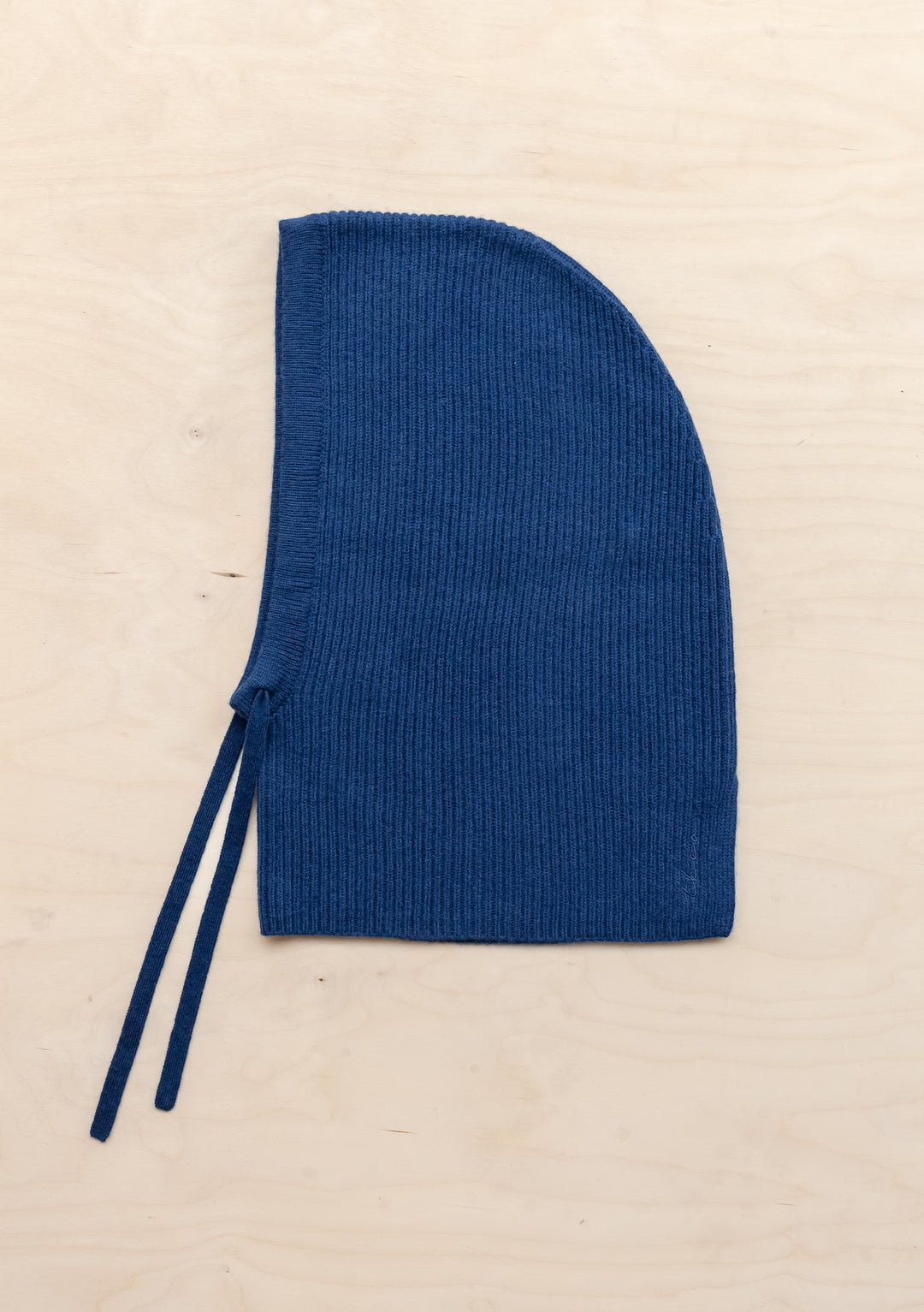 Navy ribbed merino wool TBCo Merino Hood with adjustable ties, combining beanie and scarf functionality