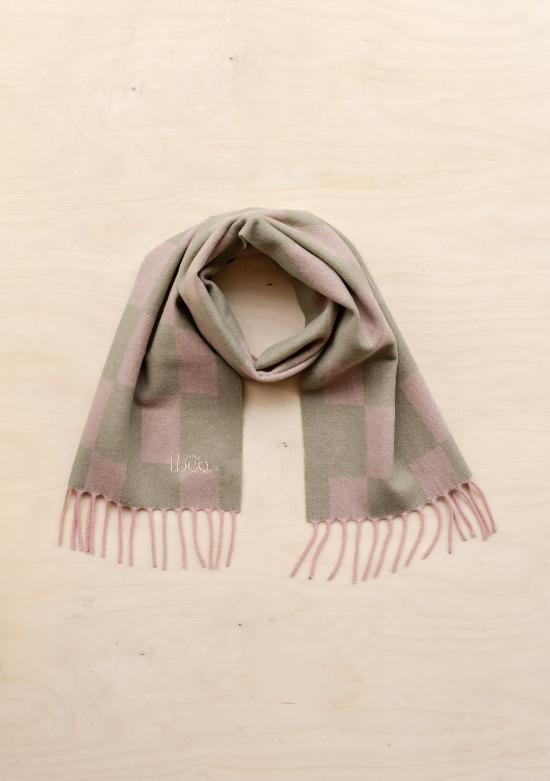 TBCo Lambswool Kids Scarf in Pink Checker pattern with fringed ends, displayed flat against cream background