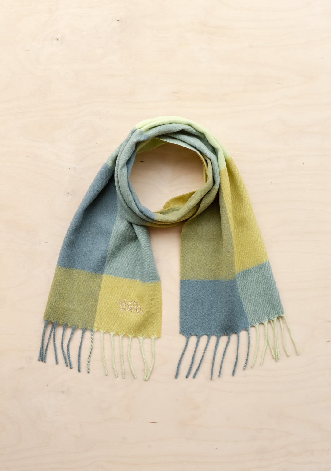 TBCo Lambswool Kids Scarf in Lime Grid Check, featuring soft woven wool in sage and yellow checkered pattern with fringed ends