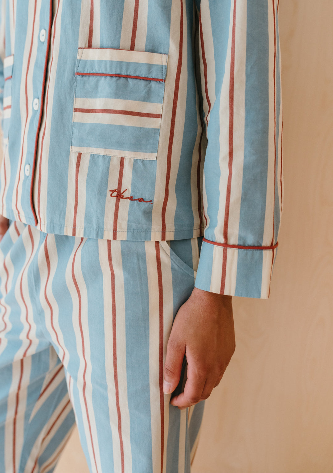 TBCo Cotton Pyjamas in Blue Stripe with red and cream stripes, featuring piped trim and chest pocket detail