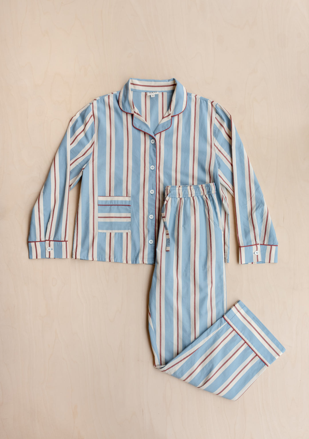 TBCo Cotton Pyjamas in Blue Stripe with red and cream vertical stripes, collared top and matching drawstring bottoms